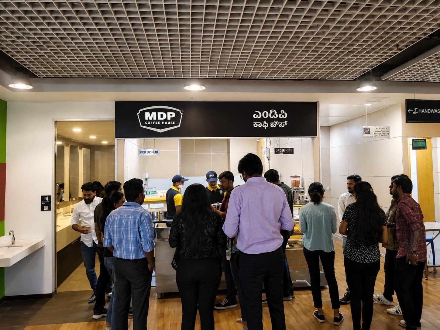 MDP Coffee House's former outlet at Northern Trust, Bengaluru, with staff serving a queue